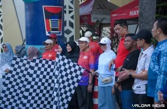 Wakil Wali Kota Padang Maigus Nasir Didampingi PJ Kadispora Qorry Saidan Saat Grand Launching BOM Run 2026 di Youth Center, Minggu (12/4/2026)